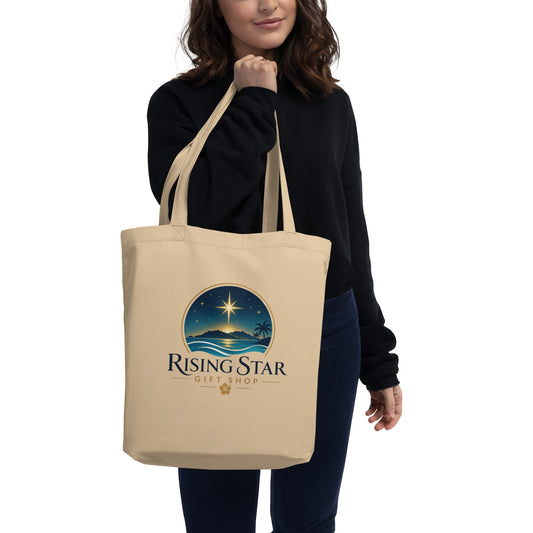 Woman carrying a natural beige Rising Star Gift Shop organic cotton tote bag with logo