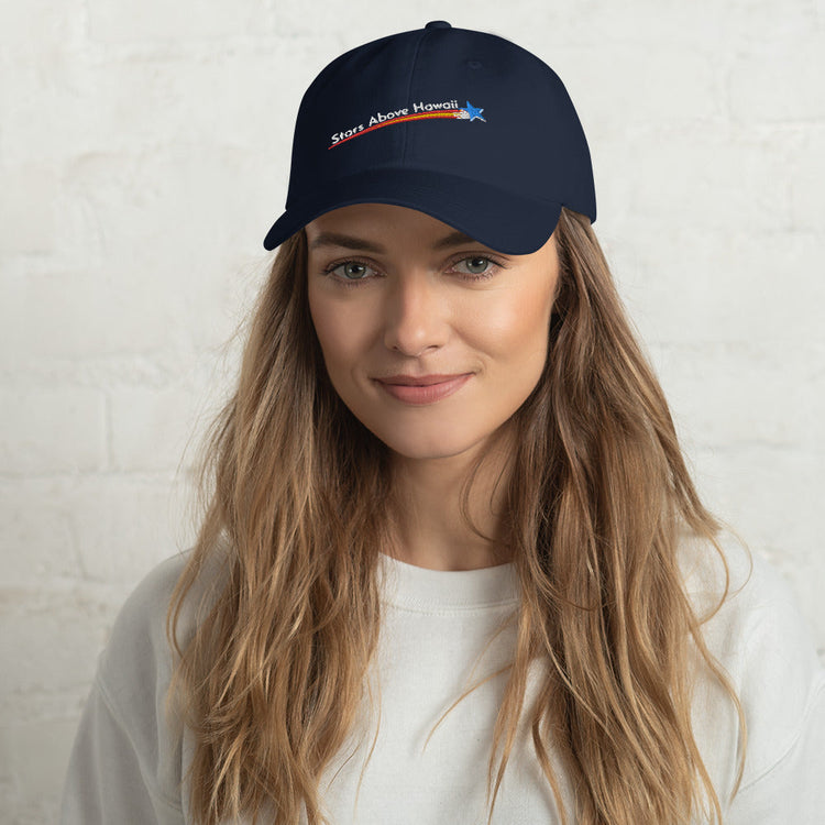 Model wearing a navy Stars Above Hawaiʻi baseball cap with an embroidered English-language logo