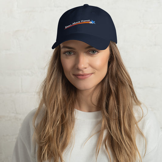 Model wearing a navy Stars Above Hawaiʻi baseball cap with an embroidered English-language logo